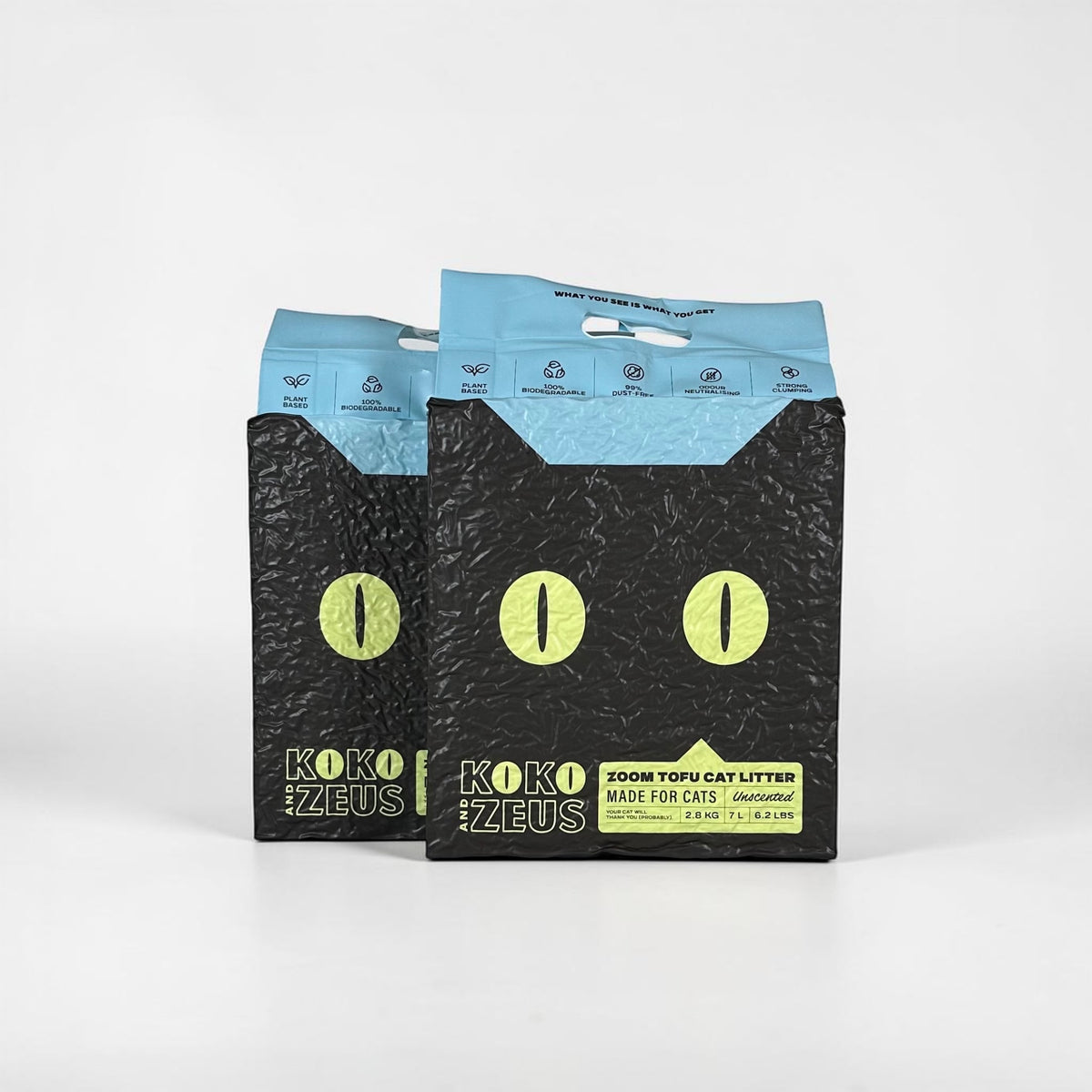 Two bags of Koko Zeus ZOOM Tofu Cat Litter on a white background